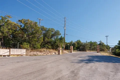 a view of a road with a building in the background
