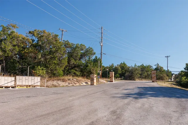 a view of a road with a building in the background