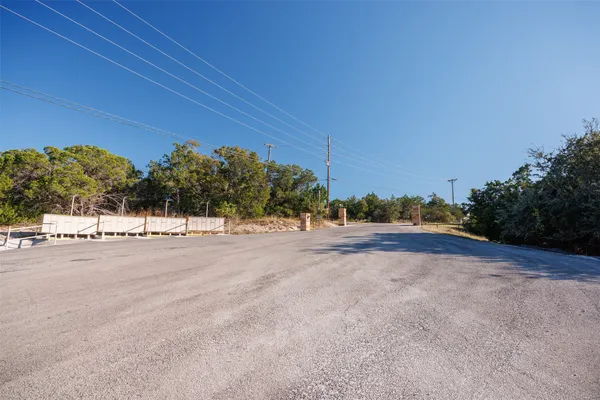 a view of a road with a building in the background