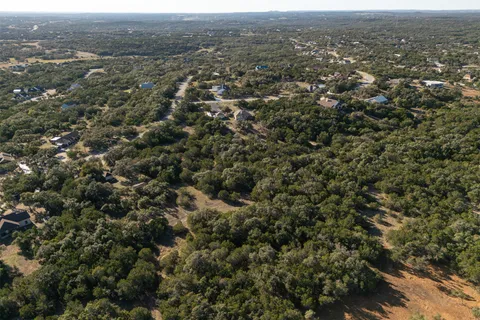 an aerial view of town with residential houses and trees