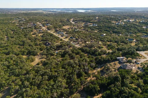 an aerial view of town with residential houses and trees