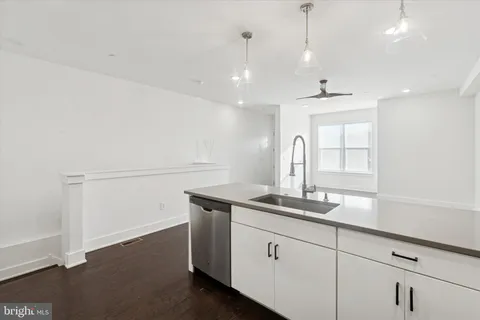 a kitchen with a sink and cabinets