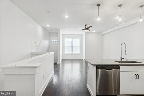 a bathroom with a sink a mirror and shower