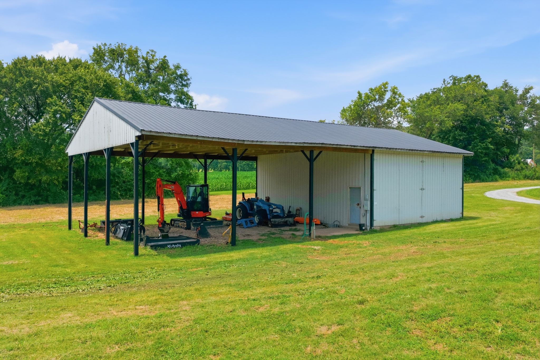 8167 Primm Springs Road Primm Springs, TN 38476 - Photo 54 of 65 a view of a backyard with a garden and entertaining space