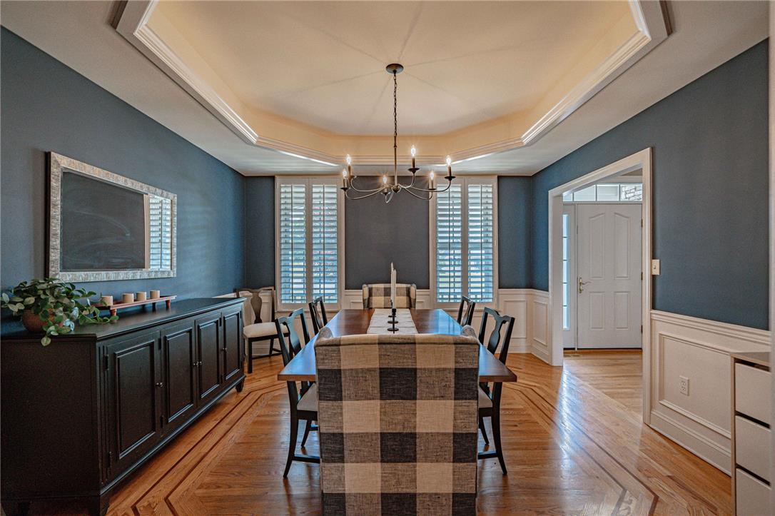 6000 Pond View Terrace Bath, PA 18014 - Photo 18 of 69 Rich hardwood floors and elegant tray ceilings define this inviting dining area.