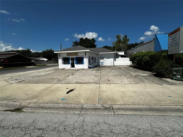 a front view of a house with parking space