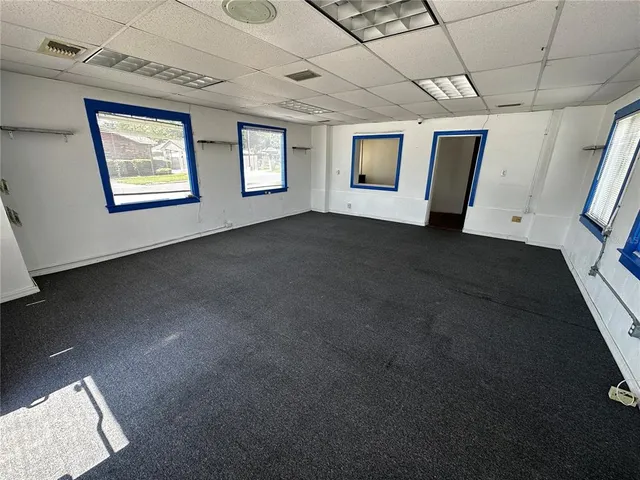 a view of an empty room with windows