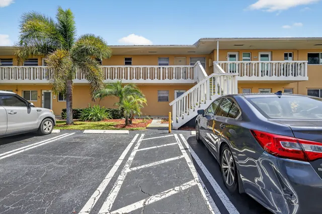 a view of a car park in front of a building