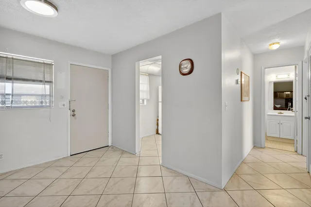 a view of a hallway with a bathroom