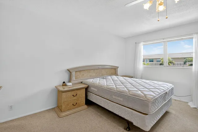 a room with a bed and a window