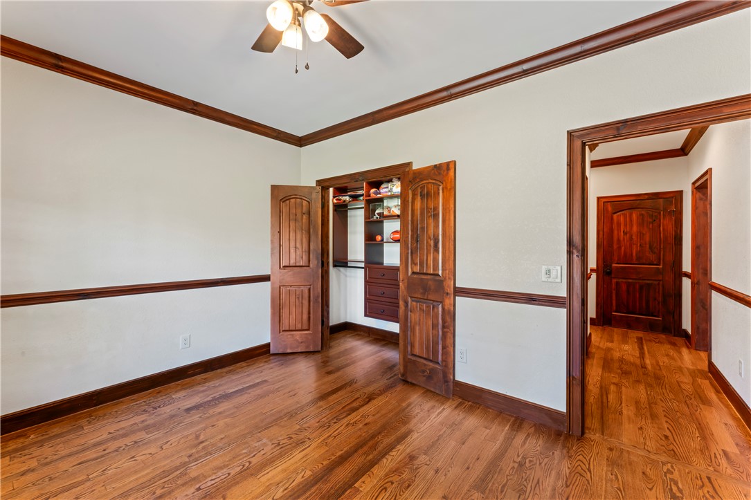 579 Terrapin Crossing Road Pickens, SC 29671 - Photo 25 of 50 Rich hardwood floors and natural wood trim create an inviting, warm interior in this bedroom with a well-organized closet
