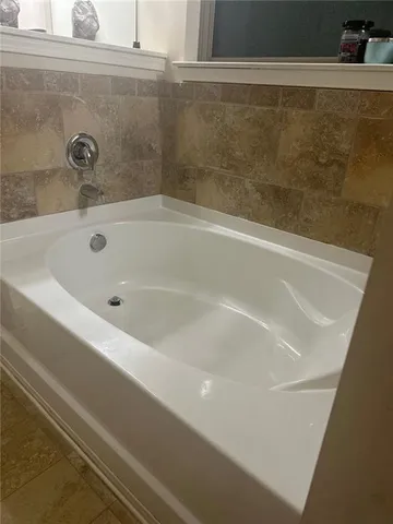 a close view of a bathtub in bathroom