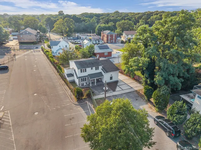 an aerial view of a house with a garden