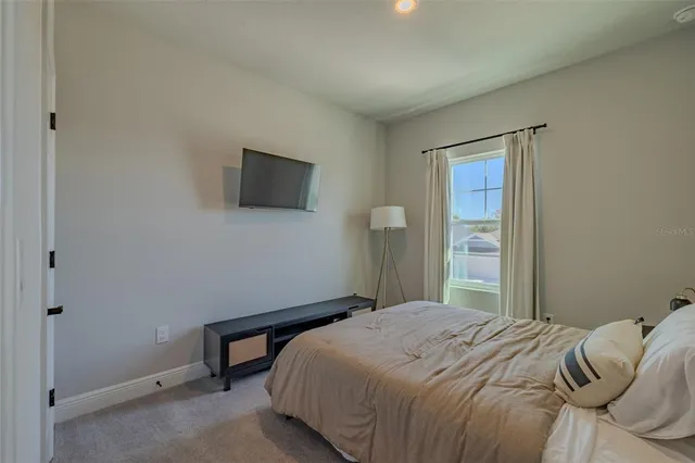 a view of a house with backyard porch and sitting area