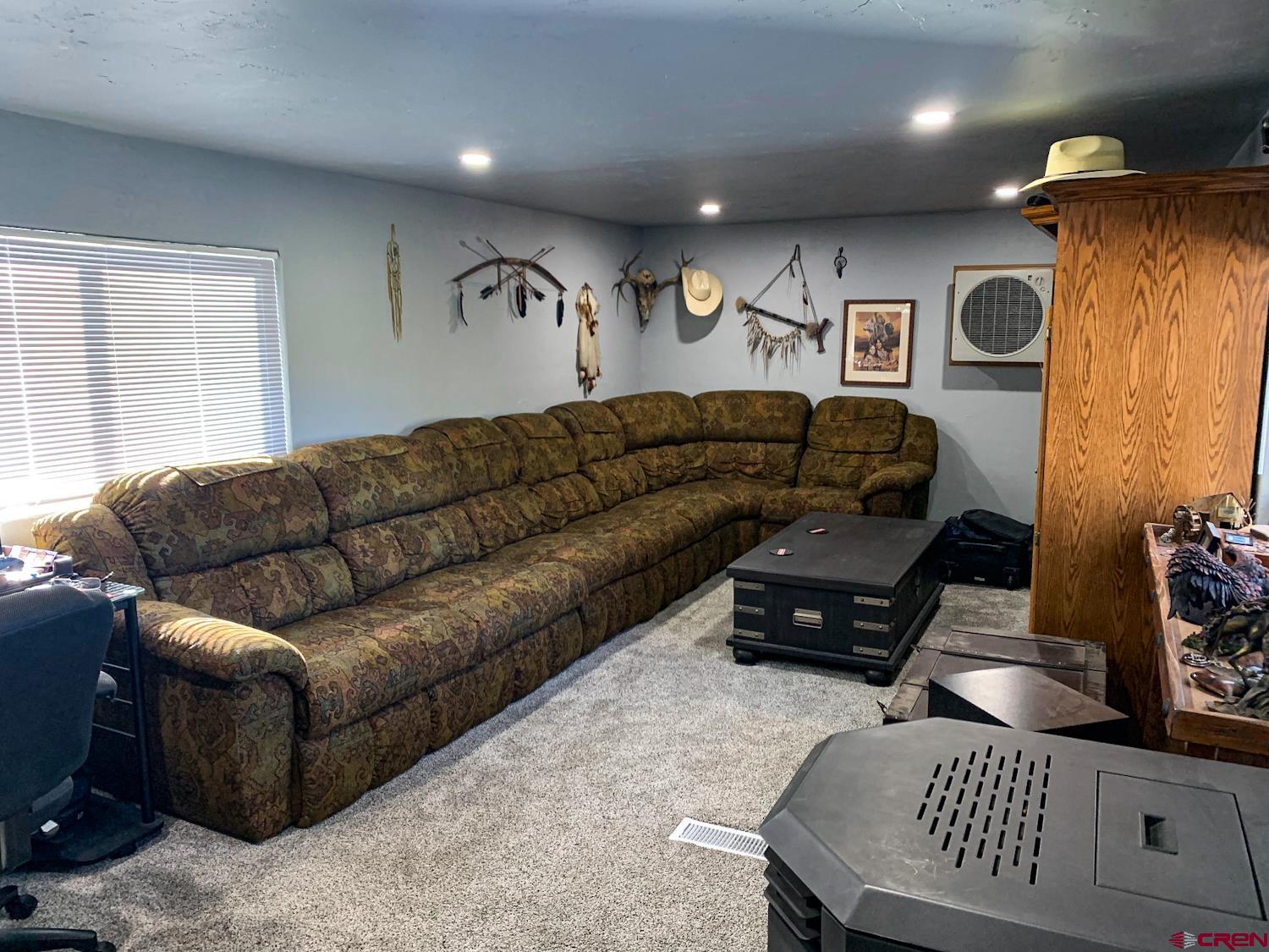 23202 Ute Trail Road Cedaredge, CO 81413 - Photo 7 of 14 a living room with furniture and a window