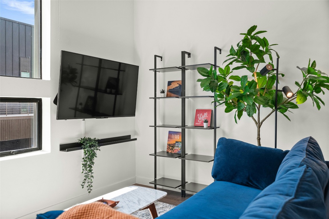 49 Navasota Street, Unit 214 Austin, TX 78702 - Photo 18 of 37 a living room with furniture and a potted plant