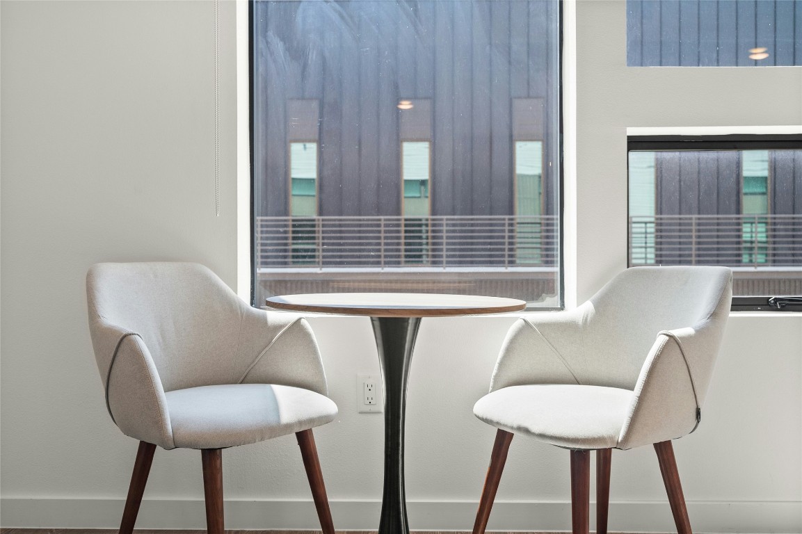 49 Navasota Street, Unit 214 Austin, TX 78702 - Photo 20 of 37 a view of a chair and table in a patio