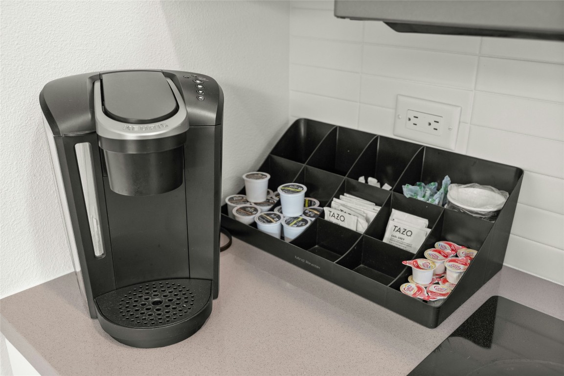 49 Navasota Street, Unit 214 Austin, TX 78702 - Photo 25 of 37 a living room with furniture and a mirror