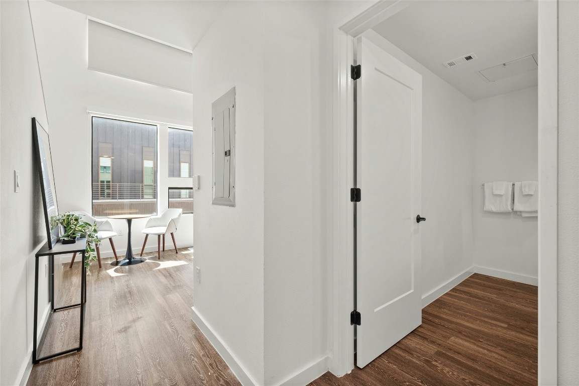 49 Navasota Street, Unit 214 Austin, TX 78702 - Photo 26 of 37 a view of a room with wooden floor and furniture