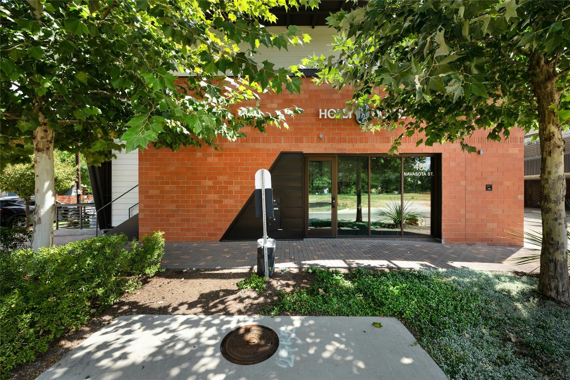 49 Navasota Street, Unit 214 Austin, TX 78702 - Photo 3 of 37 a view of a backyard with a garden