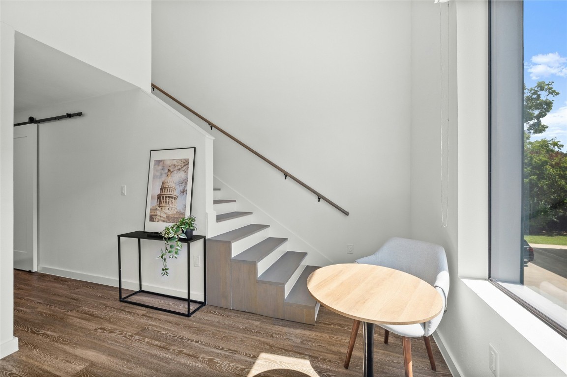 49 Navasota Street, Unit 214 Austin, TX 78702 - Photo 33 of 37 a view of entryway and hall with wooden floor