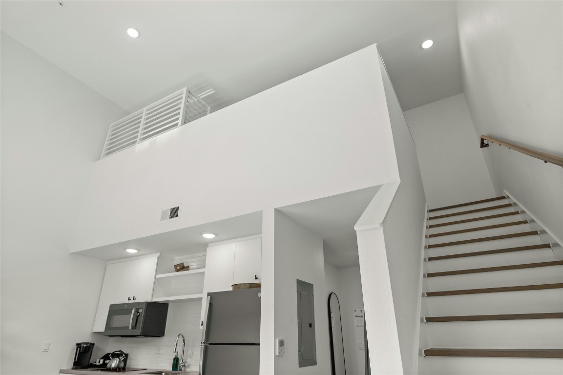 49 Navasota Street, Unit 214 Austin, TX 78702 - Photo 34 of 37 a view of entryway with furniture and wooden floor