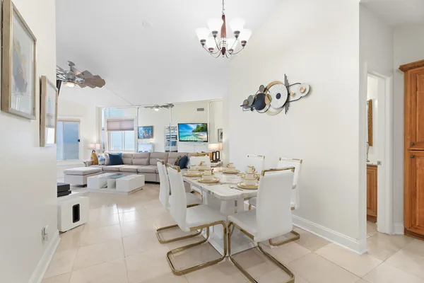 a very nice looking dining room with a table and chairs