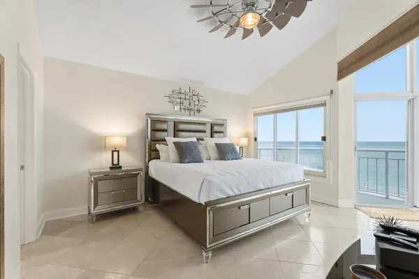 a bed room with a bed and a chandelier