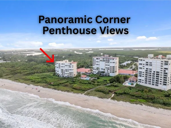 a view of a street with cars parked