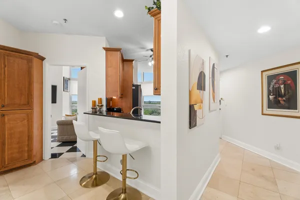 a kitchen with stainless steel appliances a refrigerator and a table