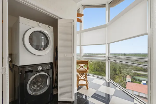 a view of a balcony and washer and dryer