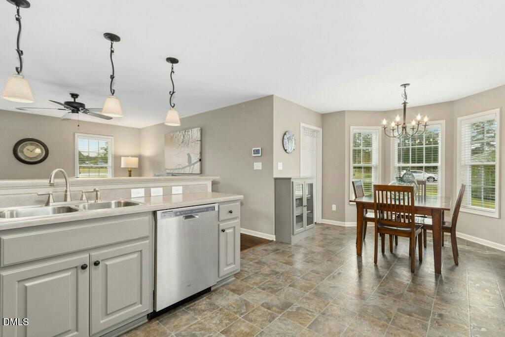 1052 Aquilla Road Benson, NC 27504 - Photo 13 of 31 a large kitchen with a table and chairs