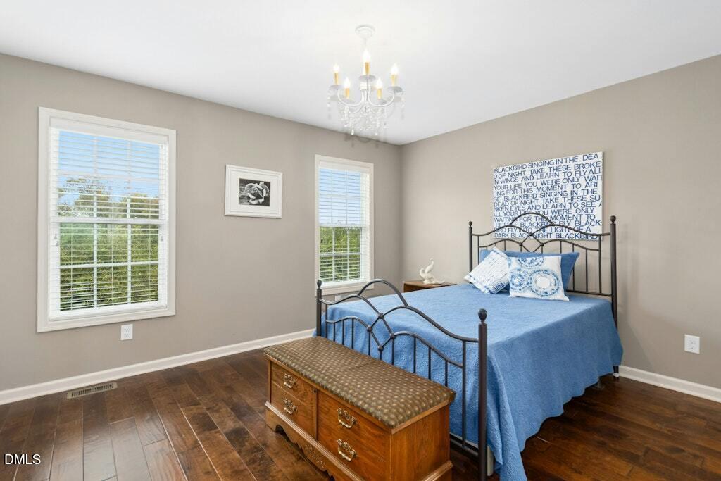 1052 Aquilla Road Benson, NC 27504 - Photo 16 of 31 a bedroom with furniture and a window