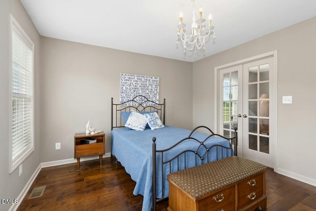 1052 Aquilla Road Benson, NC 27504 - Photo 17 of 31 a bedroom with a bed and a window
