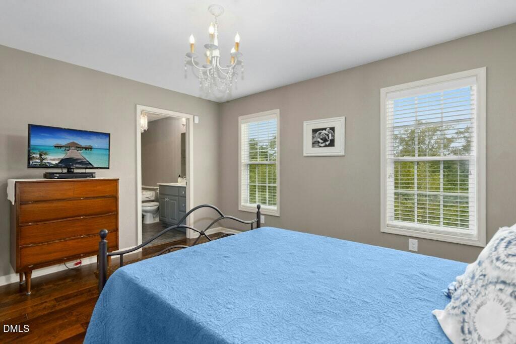 1052 Aquilla Road Benson, NC 27504 - Photo 19 of 31 a bedroom with a bed and a window