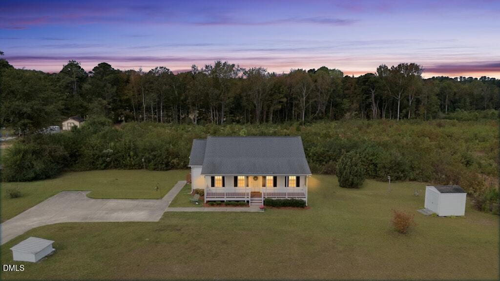 1052 Aquilla Road Benson, NC 27504 - Photo 2 of 31 a view of a back yard