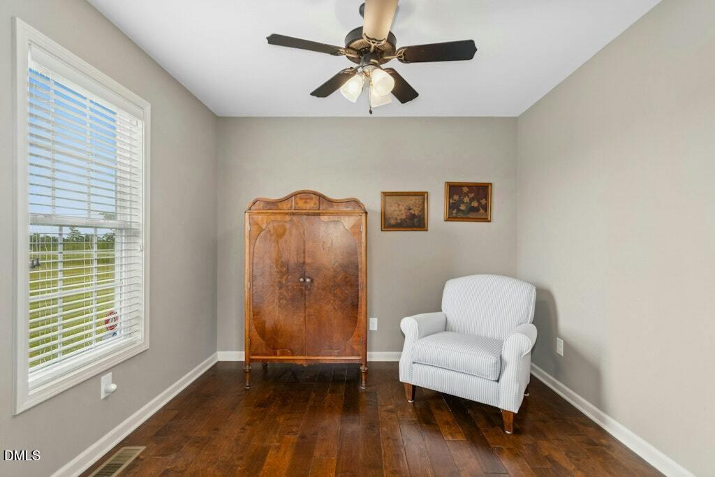 1052 Aquilla Road Benson, NC 27504 - Photo 21 of 31 a living room with furniture and a window