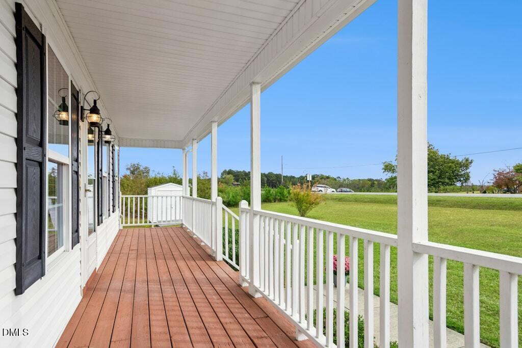 1052 Aquilla Road Benson, NC 27504 - Photo 28 of 31 a view of a balcony with wooden floor