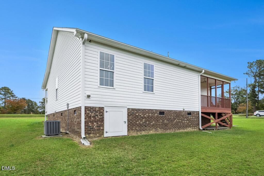 1052 Aquilla Road Benson, NC 27504 - Photo 30 of 31 a view of a house with a yard
