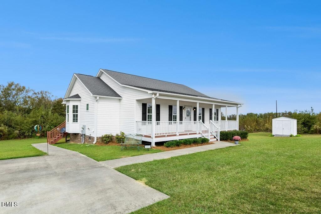 1052 Aquilla Road Benson, NC 27504 - Photo 5 of 31 a view of a house with a big yard