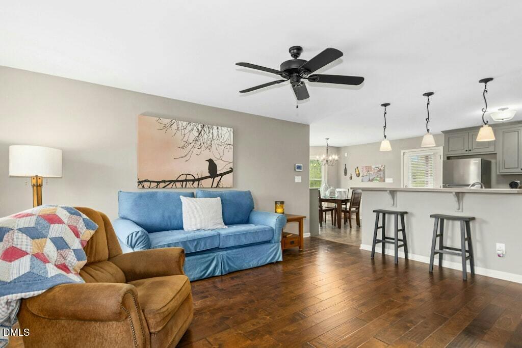1052 Aquilla Road Benson, NC 27504 - Photo 7 of 31 a living room with furniture and a view of kitchen