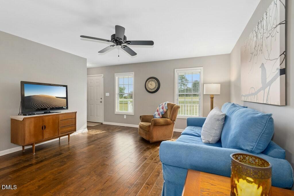 1052 Aquilla Road Benson, NC 27504 - Photo 8 of 31 a living room with furniture and a flat screen tv