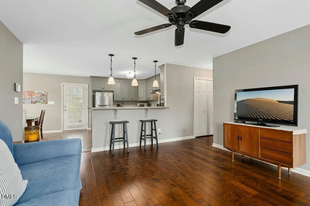 1052 Aquilla Road Benson, NC 27504 - Photo 10 of 31 a living room with furniture and a flat screen tv
