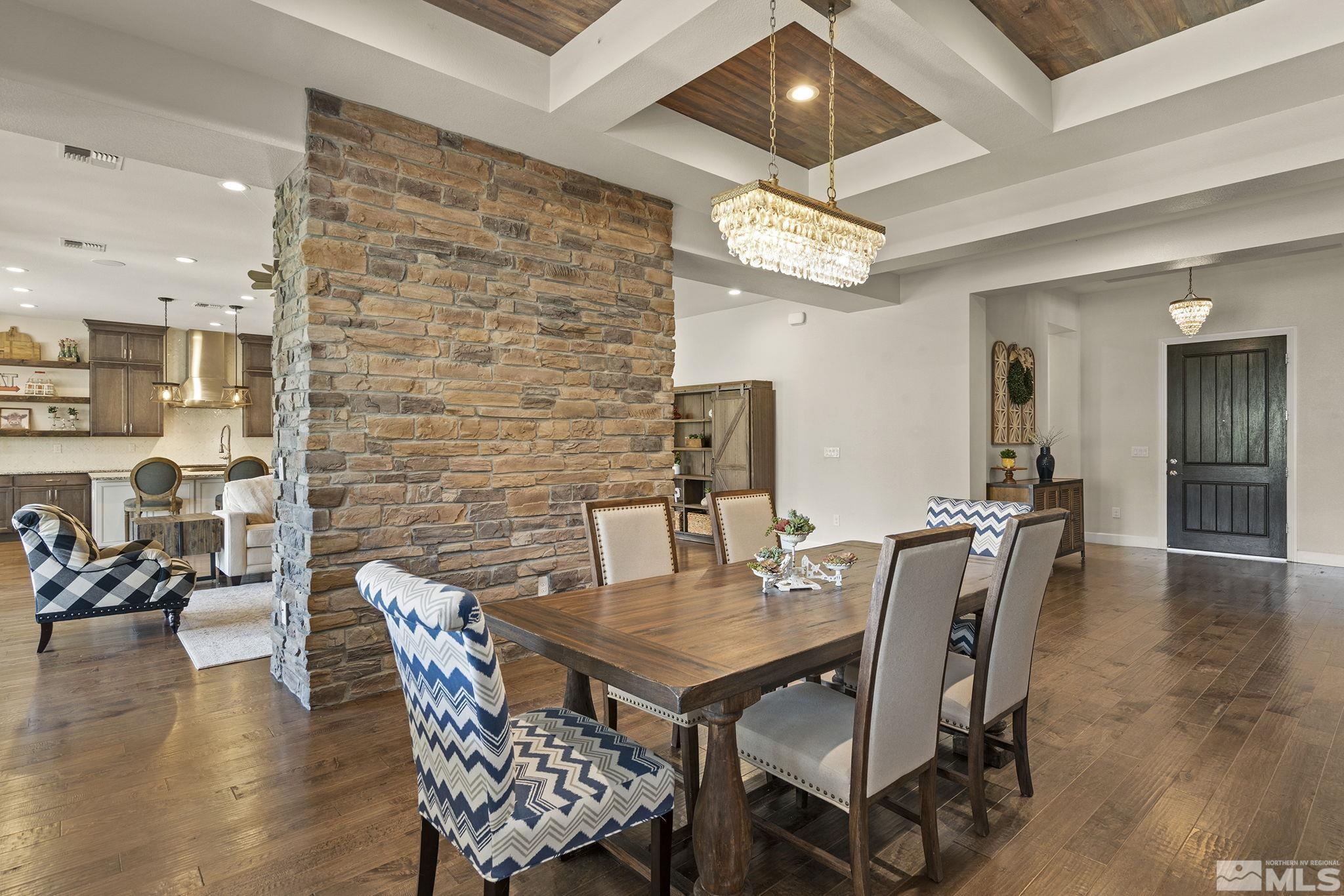 9716 Silverspar Street Reno, NV 89521 - Photo 13 of 40 a dining room with furniture and wooden floor