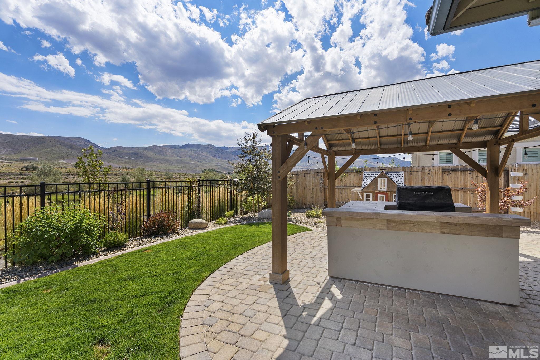 9716 Silverspar Street Reno, NV 89521 - Photo 33 of 40 a view of a porch and garden