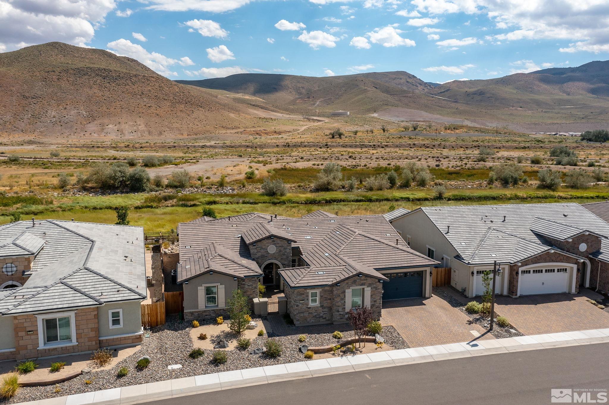 9716 Silverspar Street Reno, NV 89521 - Photo 39 of 40 an aerial view of residential houses with outdoor space