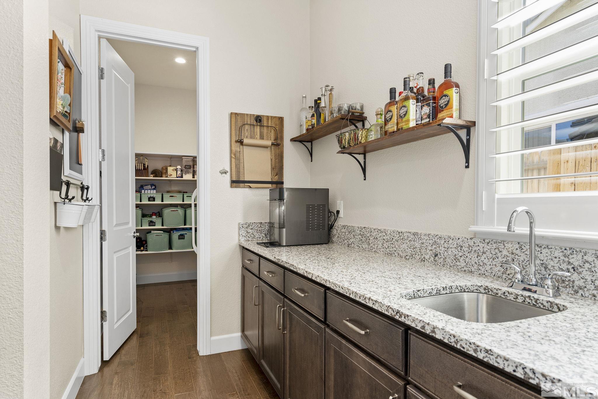 9716 Silverspar Street Reno, NV 89521 - Photo 8 of 40 a kitchen with a sink and a refrigerator