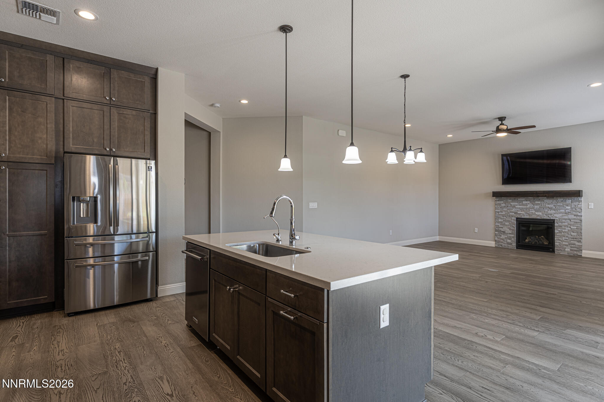 2109 Cast Iron Drive Reno, NV 89521 - Photo 6 of 35 a kitchen with kitchen island a sink stainless steel appliances and wooden floor