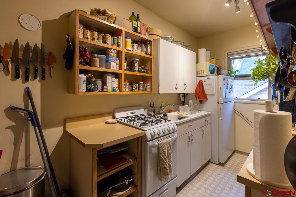 558 East 4th Avenue Durango, CO 81301 - Photo 11 of 15 a kitchen that has a table and chairs in it