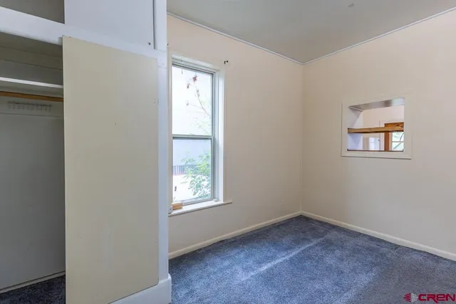 an empty room with windows